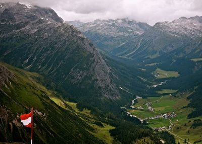 Scenic view of mountains against cloudy sky