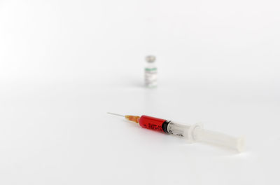 Close-up of cigarette over white background