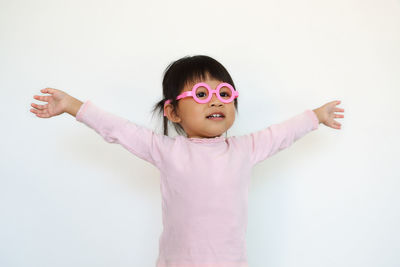 Portrait of a smiling girl over white background