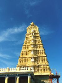 Statue of temple against cloudy sky