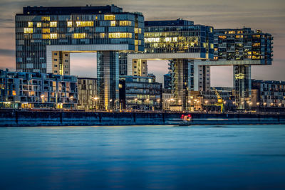 Skyscrapers in city at dusk