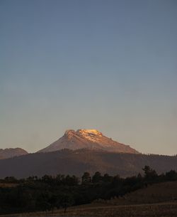 Scenic view of mountains against clear sky