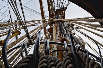 Low angle view of tall ship rigging