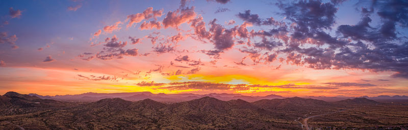 Scenic view of mountains against sky during sunset