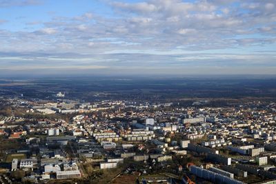 High angle view of city against cloudy sky