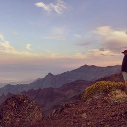 Scenic view of mountains against cloudy sky