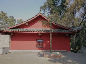 Red outside house against sky