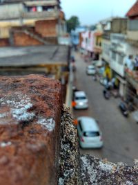 Close-up of cars on road in city