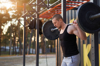 Young man exercising at park