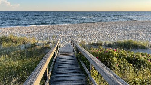 Boardwalk leading to beach and ocean at chatham , cape cod