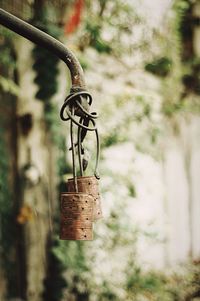 Close-up of padlock hanging on metal