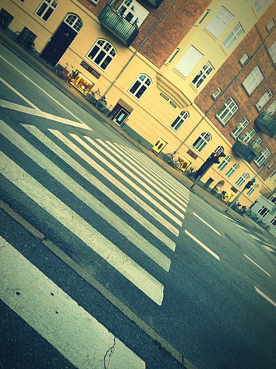 architecture, road marking, built structure, road, city, the way forward, outdoors, day, building, no people, city life, empty, diminishing perspective