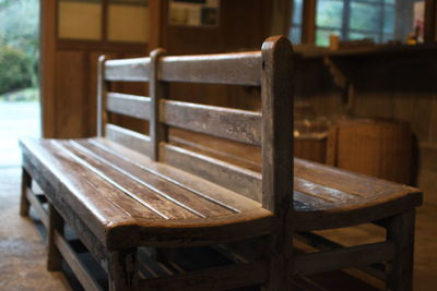 Empty wooden bench on floor