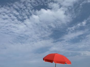 Low angle view of umbrella against sky