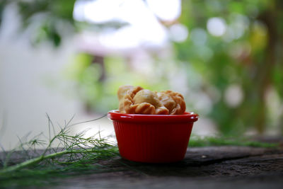 Close-up of red apple on table