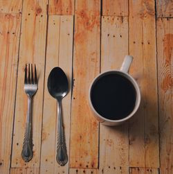 High angle view of coffee and spoon on table