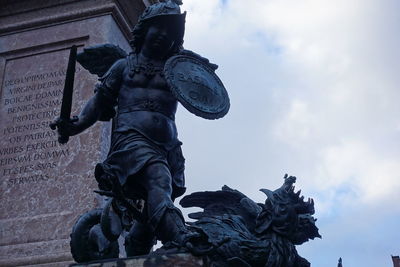 Low angle view of statue against sky