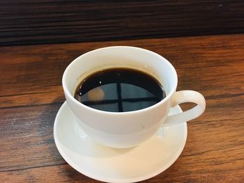 Close-up of coffee cup on table