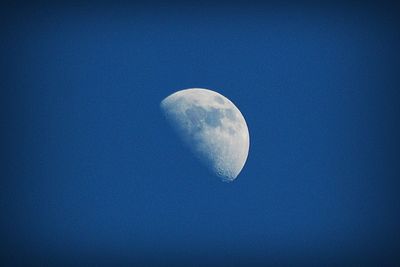 Close-up of moon against blue sky