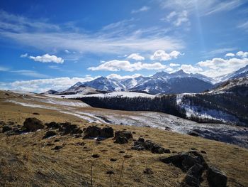 Scenic view of snowcapped mountains against sky