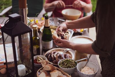 Midsection of woman preparing food on table