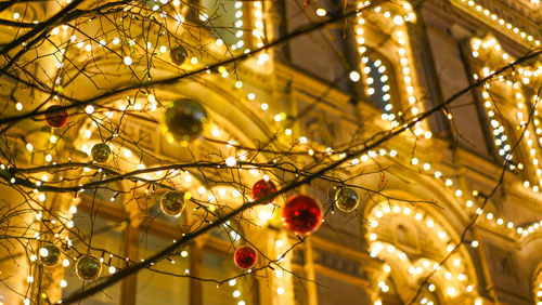 Low angle view of illuminated christmas lights hanging on ceiling