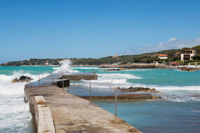 Scenic view of sea against clear blue sky