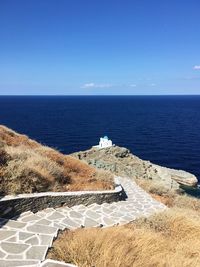 High angle view of sea against clear blue sky