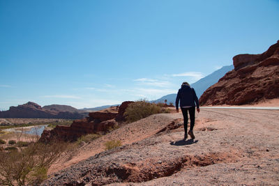 Woman walking in the mountains