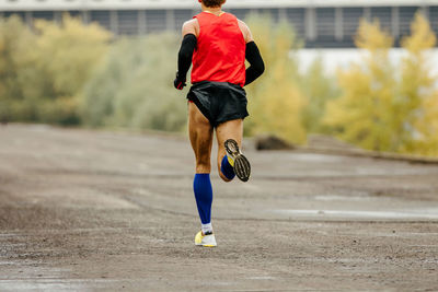 Rear view of man running