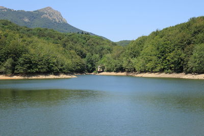 Lake with mountain range in background