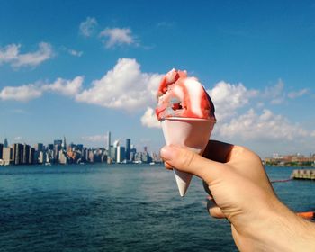 Cropped image of hand holding ice cream