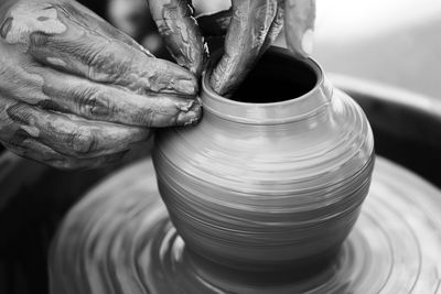 Hands of a potter. potter making ceramic pot on the pottery wheel