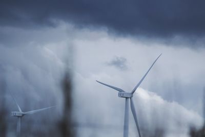 Low angle view of wind turbine against sky