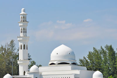 Low angle view of church against blue sky