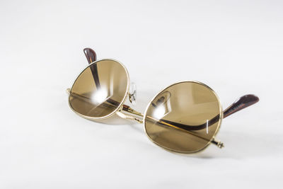 Close-up of sunglasses against white background