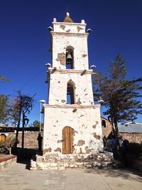 Low angle view of church against blue sky