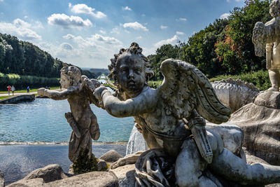 Detail of a carrara marble statue part of the fountain of venus and adonis at caserta royal palace