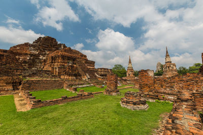 Old ruins of temple against cloudy sky