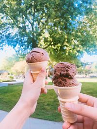 Cropped image of hands holding ice cream cones