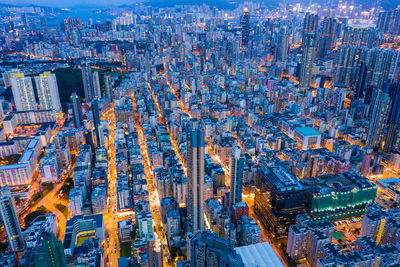 High angle view of city lit up at dusk