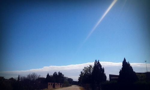 Panoramic view of landscape against clear blue sky