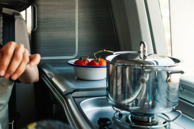 Woman preparing food in kitchen at móvil home