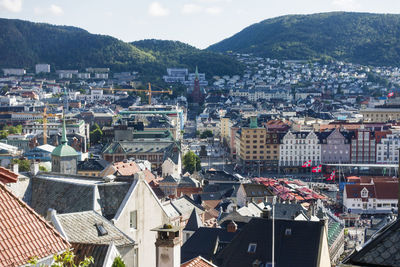 High angle view of houses in town against sky