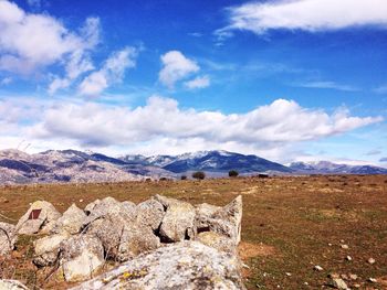 Scenic view of mountains against cloudy sky