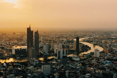 High angle view of city buildings during sunset