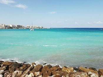 Scenic view of sea against cloudy sky