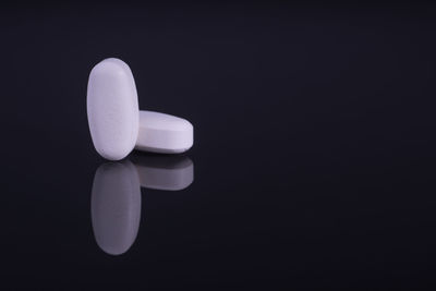 Close-up of white light over black background