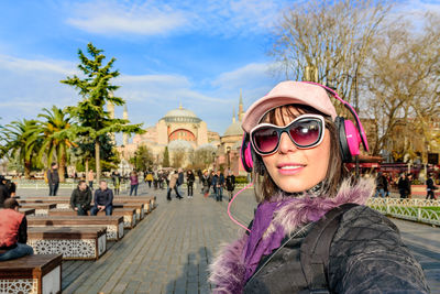 Portrait of smiling woman against hagia sophia museum