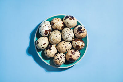 High angle view of ice cream against blue background